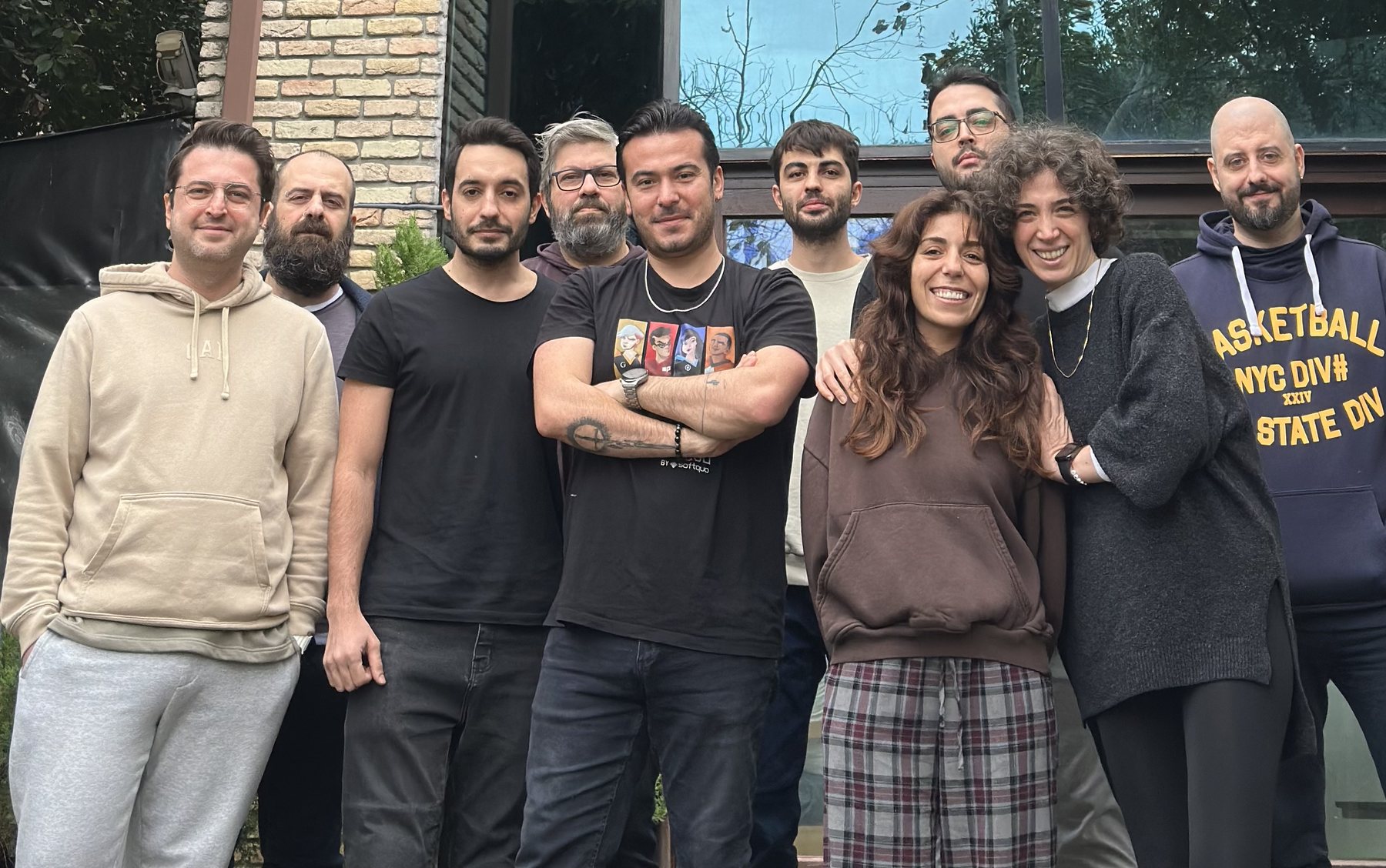 The Mafia Games team standing together outside the studio
